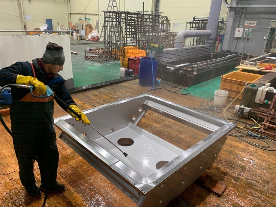 Industrial filter housing scale removal via acid pickling